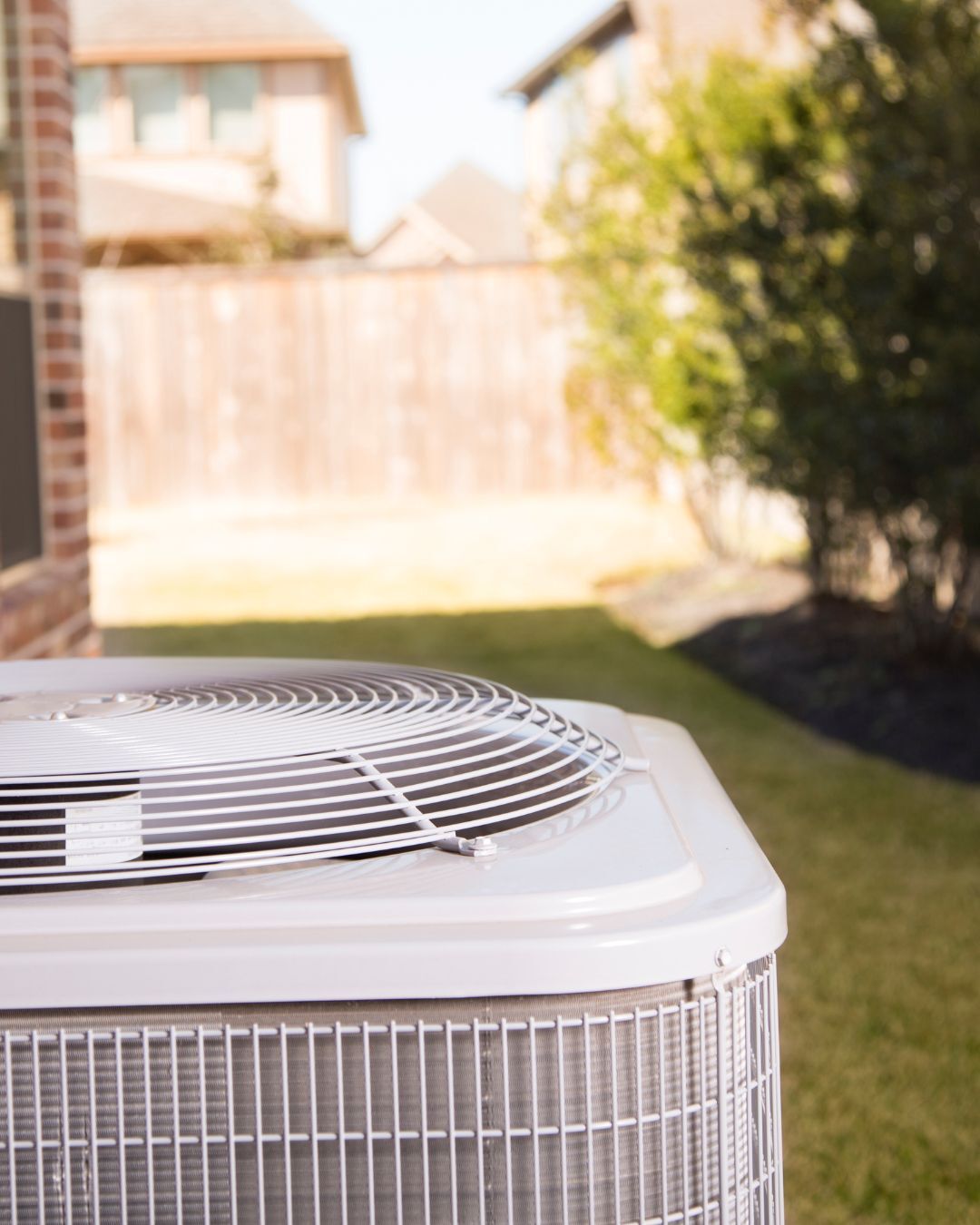 An AC unit outdoors on a sunny summer day